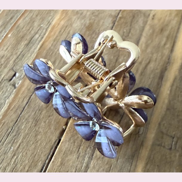 Lille h�rsp�nde � M�rke lilla blomster