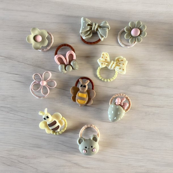 Sde elastikker med forskellige figur i - Lyserde, cremede, brune farver