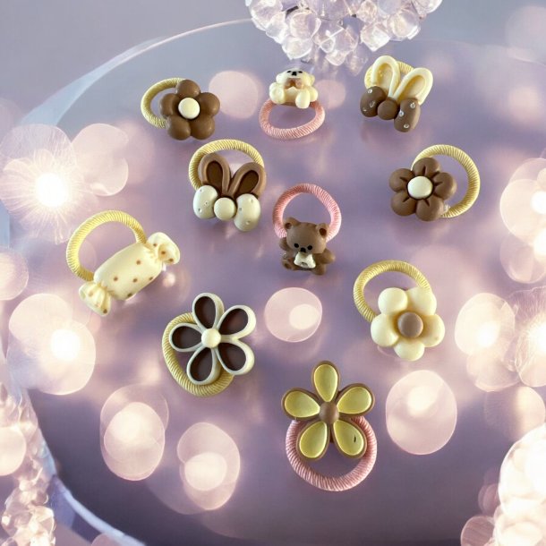 Sde elastikker med forskellige figur i - Lyserde, cremede, brune farver