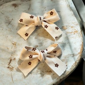 2 sljfer- brun blomster