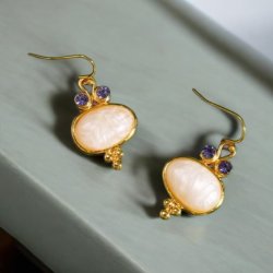 reringe med smukke lilla zirkonia sten