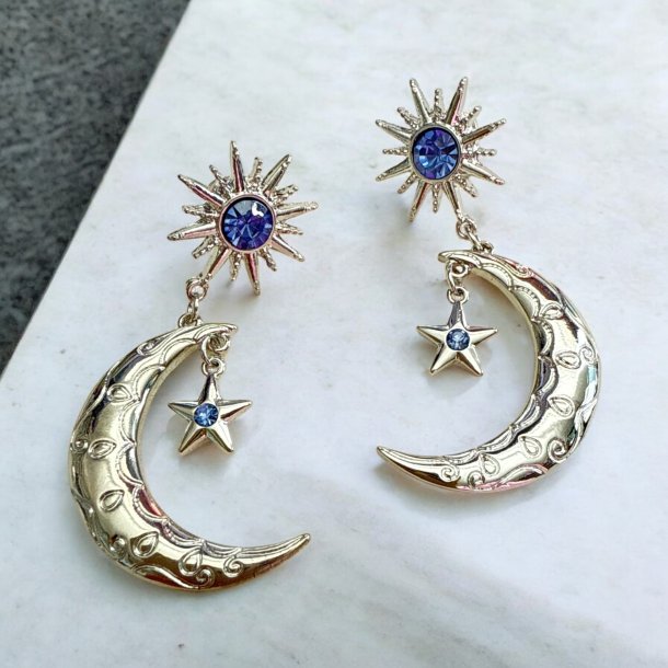 Sol og mne reringe med lilla rhinsten 