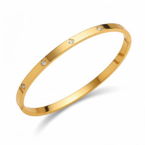 Elegant guldfarvet armb�nd med sten