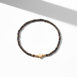 M�rkt elastikarmb�nd med guldfarvet hjerte