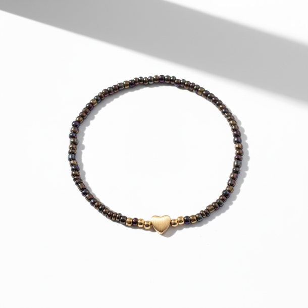 M�rkt elastikarmb�nd med guldfarvet hjerte