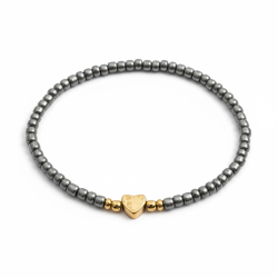 Gr�t elastikarmb�nd med guldfarvet hjerte