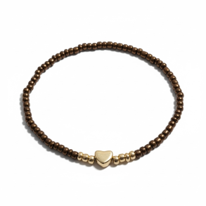Brunt elastikarmb�nd med guldfarvet hjerte