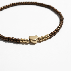 Brunt elastikarmb�nd med guldfarvet hjerte