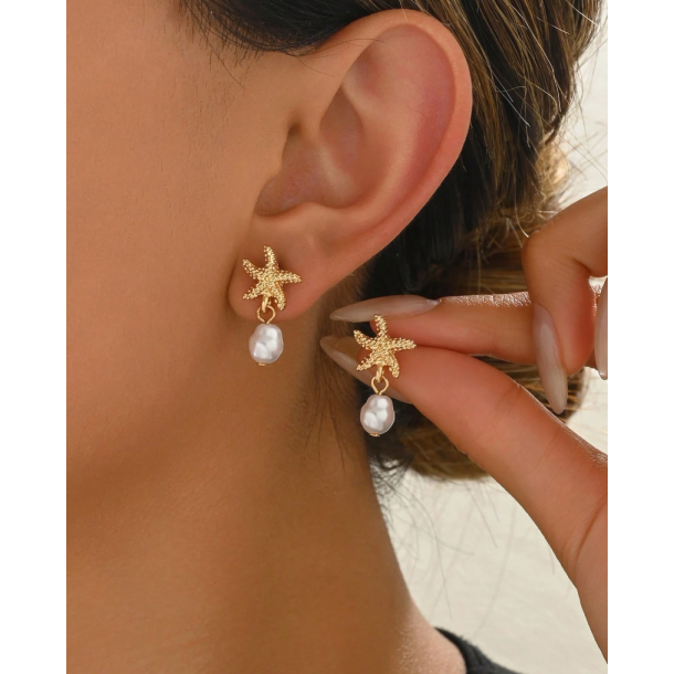 reringe med sstjerne og smuk hvid perle