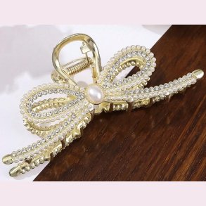 Elegant guld hrspnde med hvide perler og krystaller