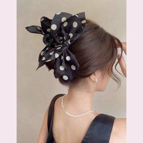 Hrklemme med stor sort sljfe med prikker