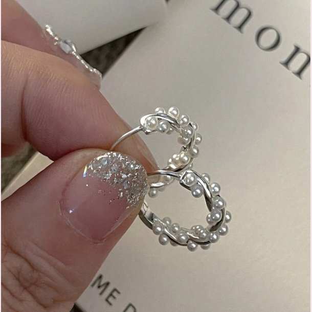Snoet reringe med fine hvide perler  - Slv